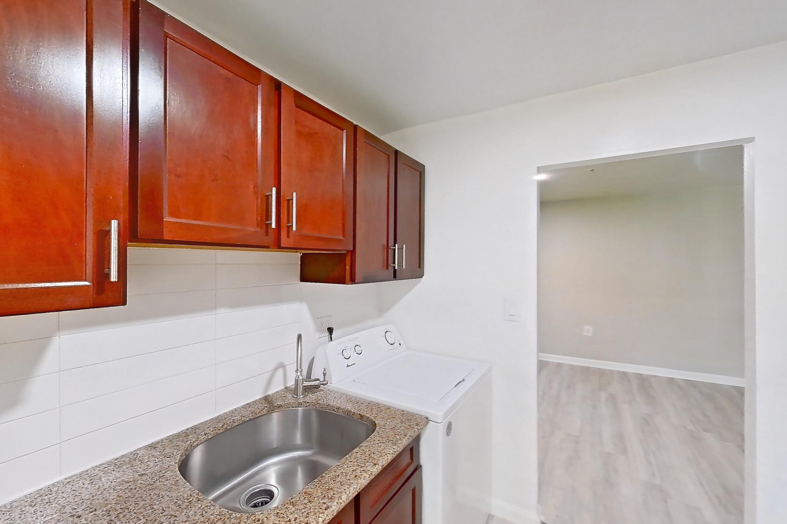Kitchen in a Two Bedroom w/Washer and Dryer floor plan apartment, representative of Apartment 9310ER22 at Franklin Park at Greenbelt Station
