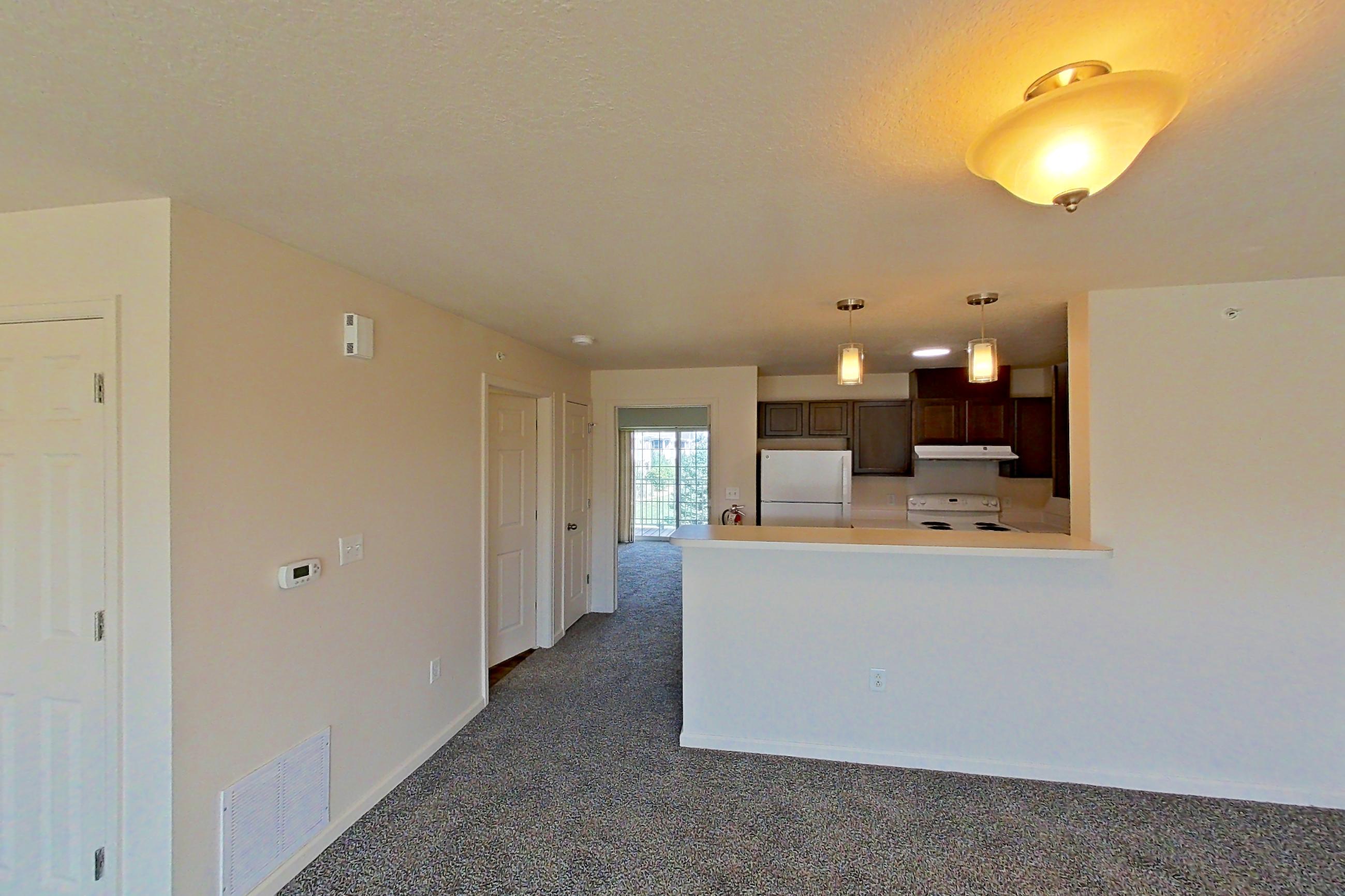 Living space with electric range, oven/range, refrigerator, and white appliances, Apartment 6469-206 at Ashley Estates