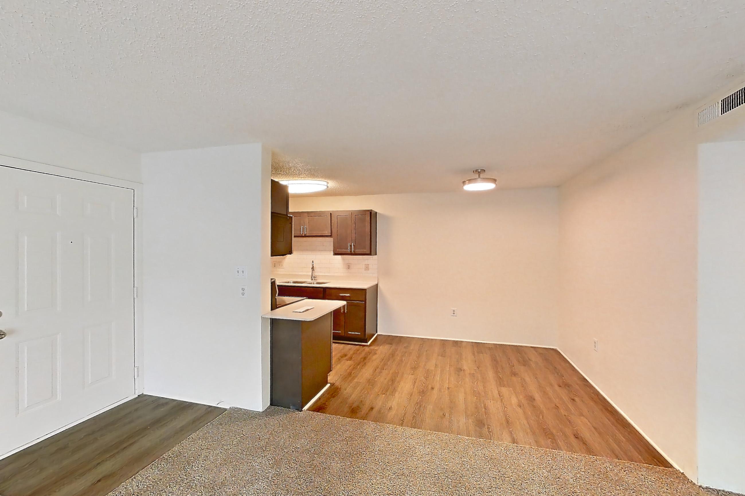 Living space with fireplace, Apartment 61302 at The Boulders
