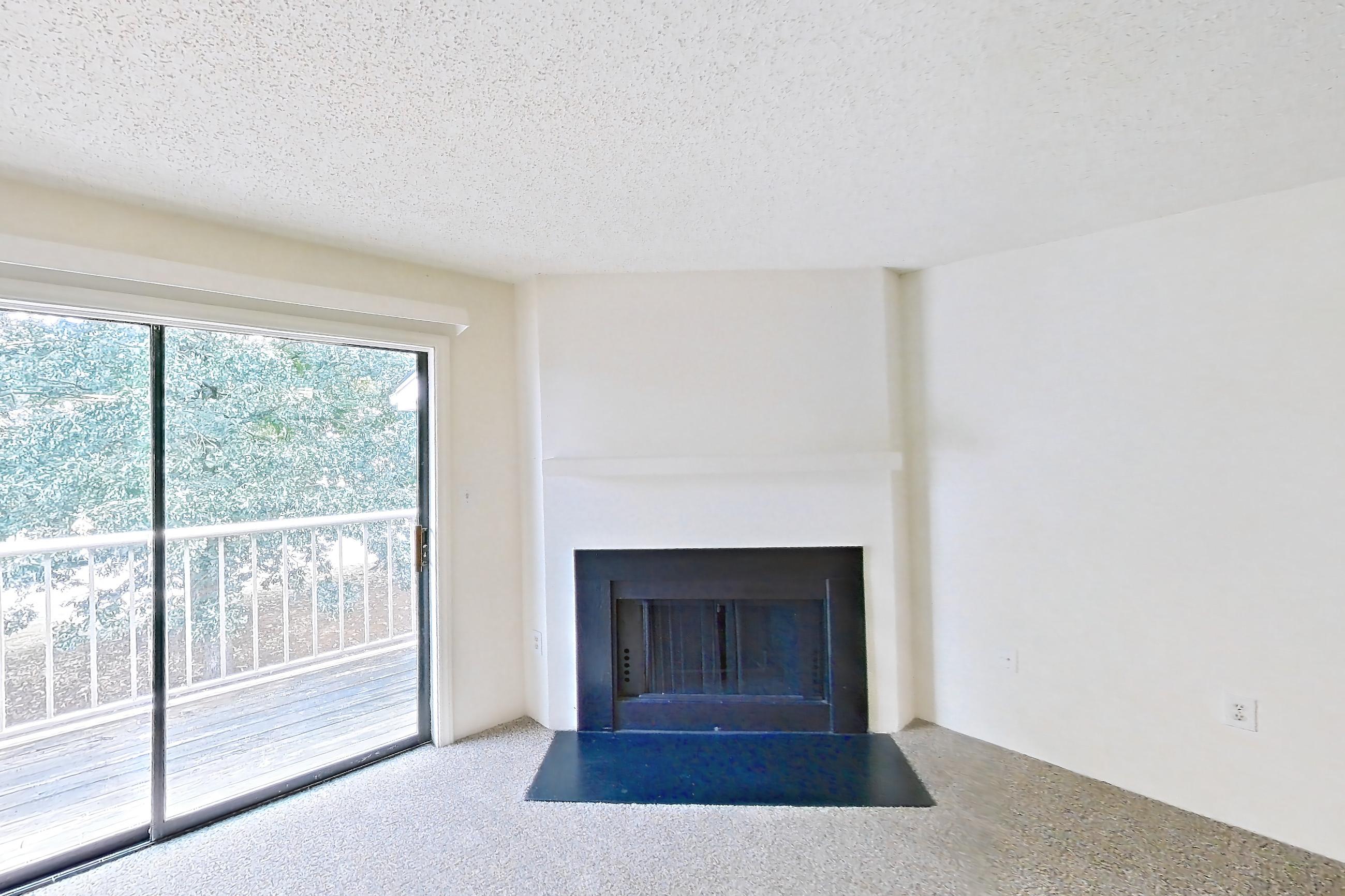 Living space with fireplace, Apartment 61302 at The Boulders