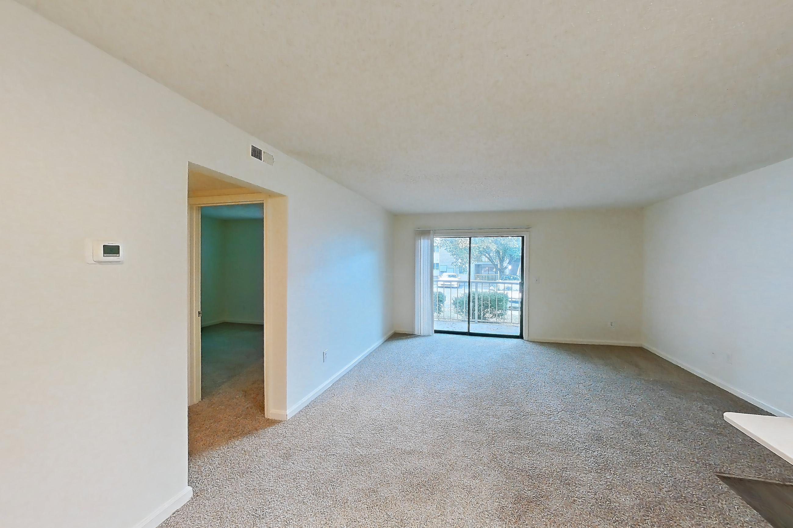 Dining room with electric range, light carpet, light countertops, light stone countertops, light wood-finish flooring, microwave, oven/range, refrigerator, and stainless steel appliances, Apartment 68104 at The Boulders