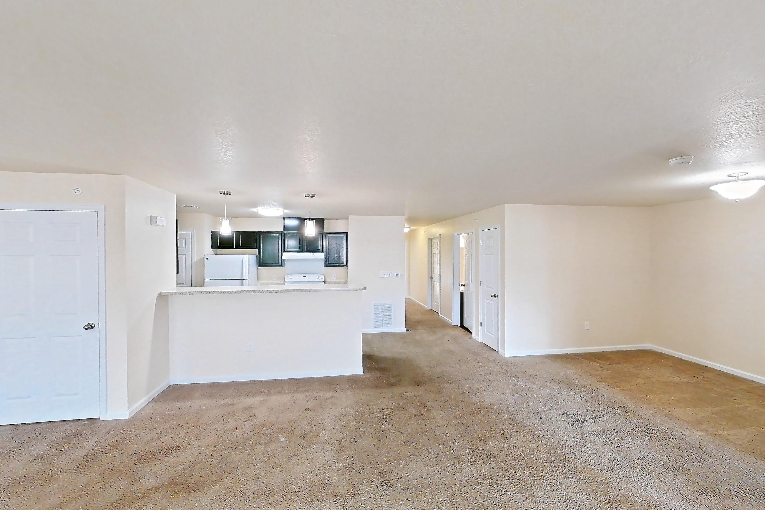 Living space with oven/range and white appliances, Apartment 19400 E 57th Ave - Unit 204 at The Meadows at Dunkirk