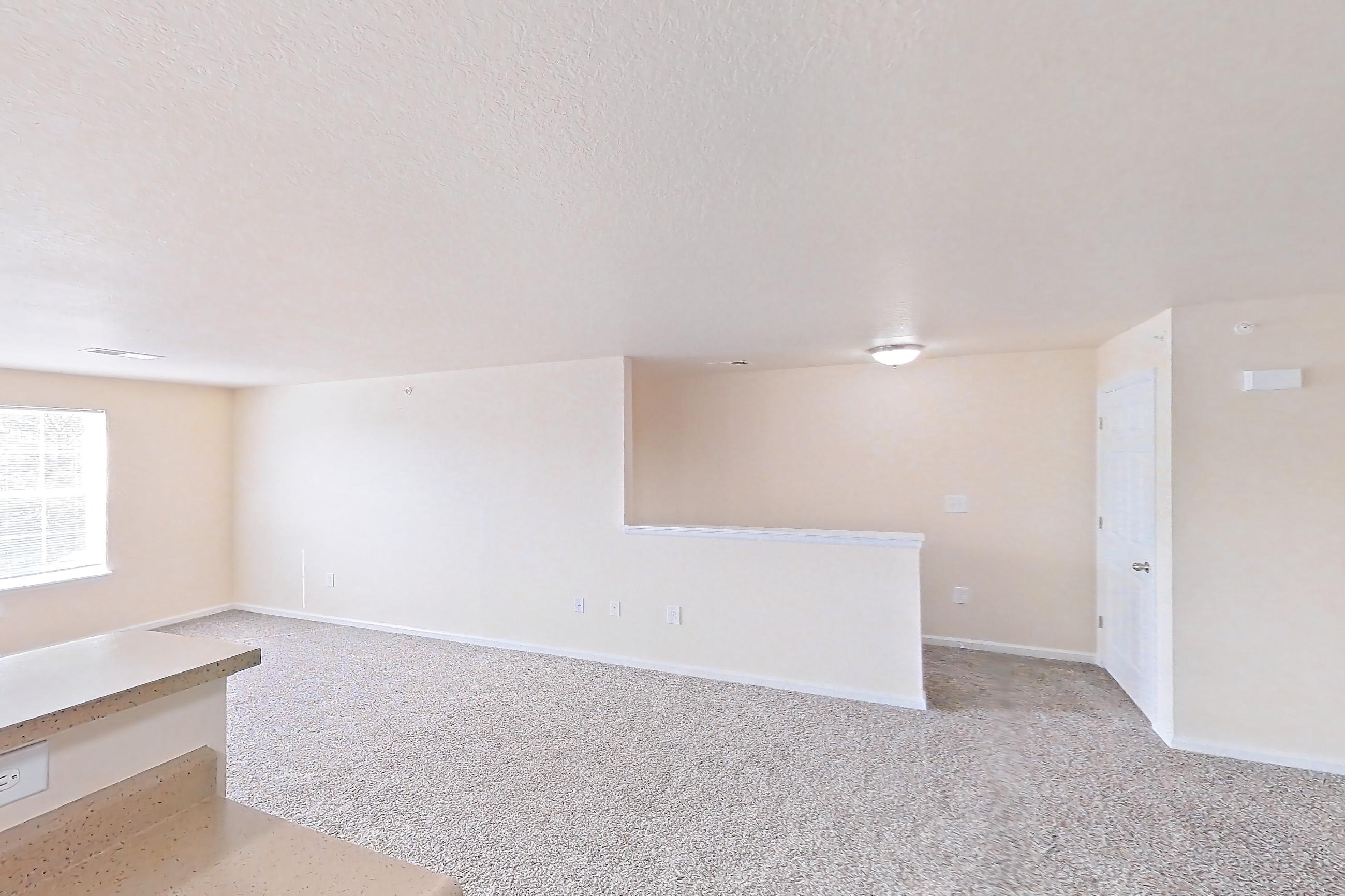 Kitchen with dark wood-finish flooring, dishwasher, electric range, light countertops, oven/range, refrigerator, and white appliances, Apartment 19573 E 57th Ave - Unit 204 at The Meadows at Dunkirk