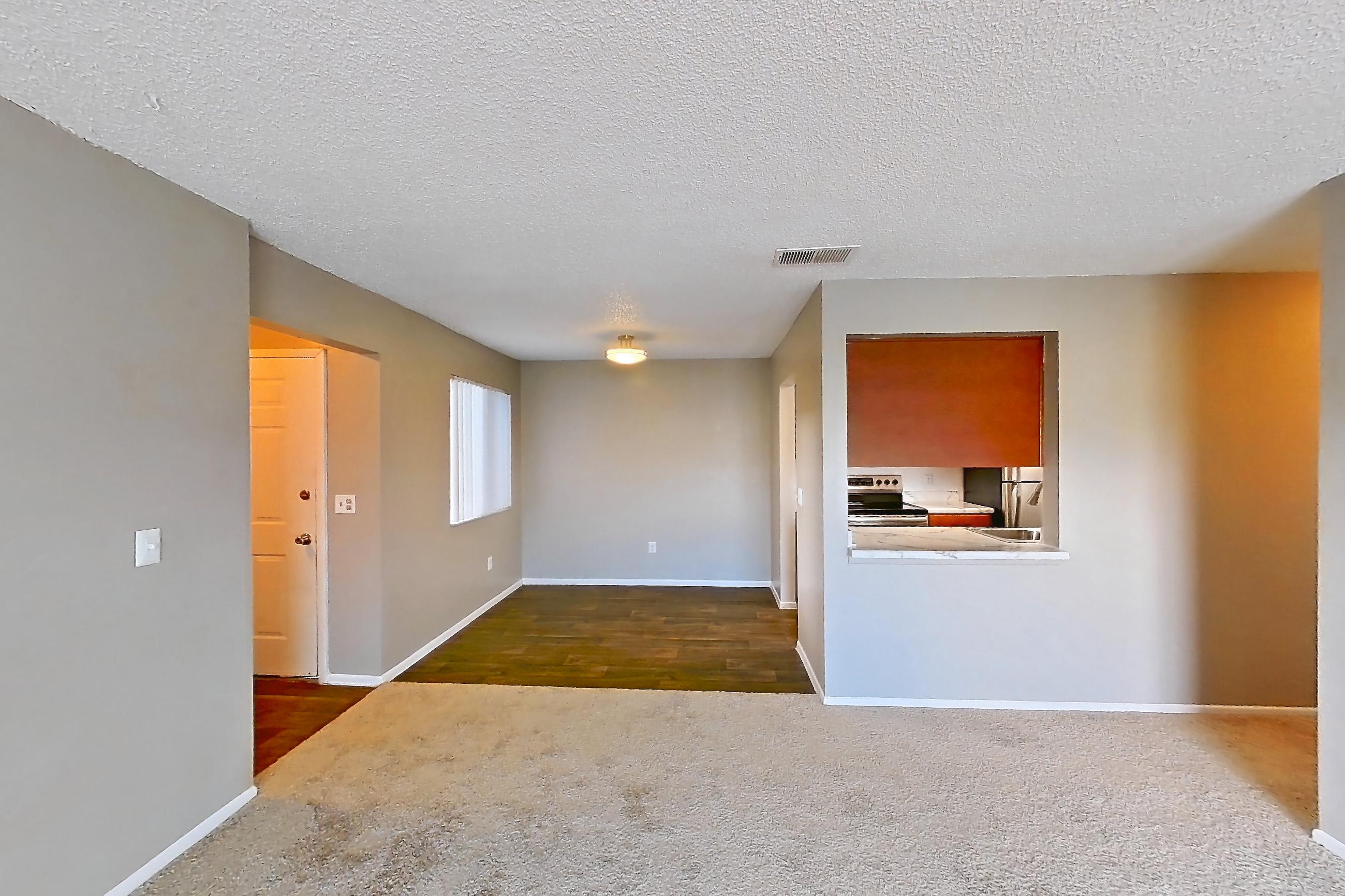 Living space with electric range, oven/range, and stainless steel appliances, Apartment 4060 Unit 10 at Aaron Lake Apartments