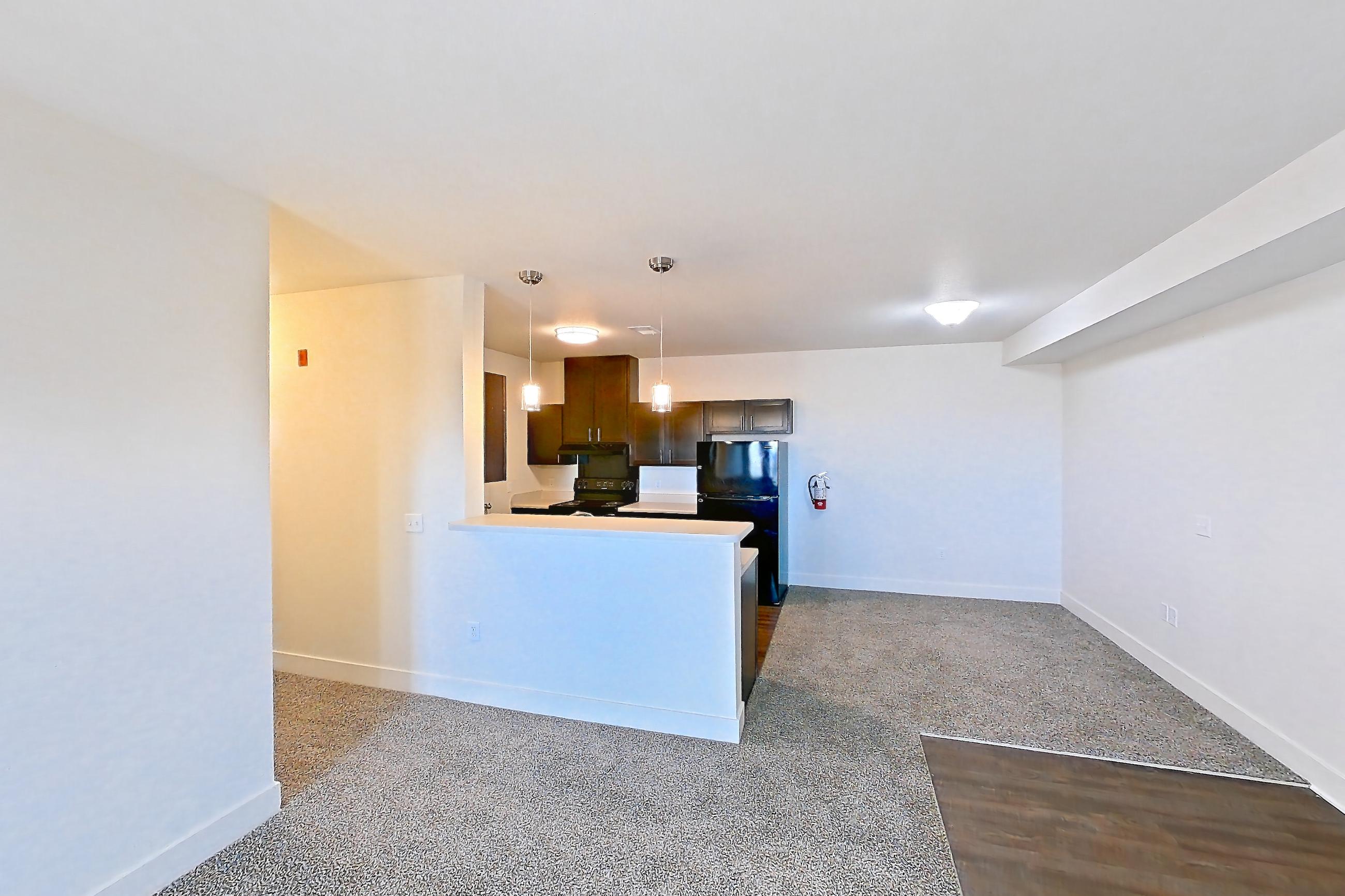 Living space with black appliances, electric range, oven/range, and refrigerator, Apartment 8304 at Larkridge