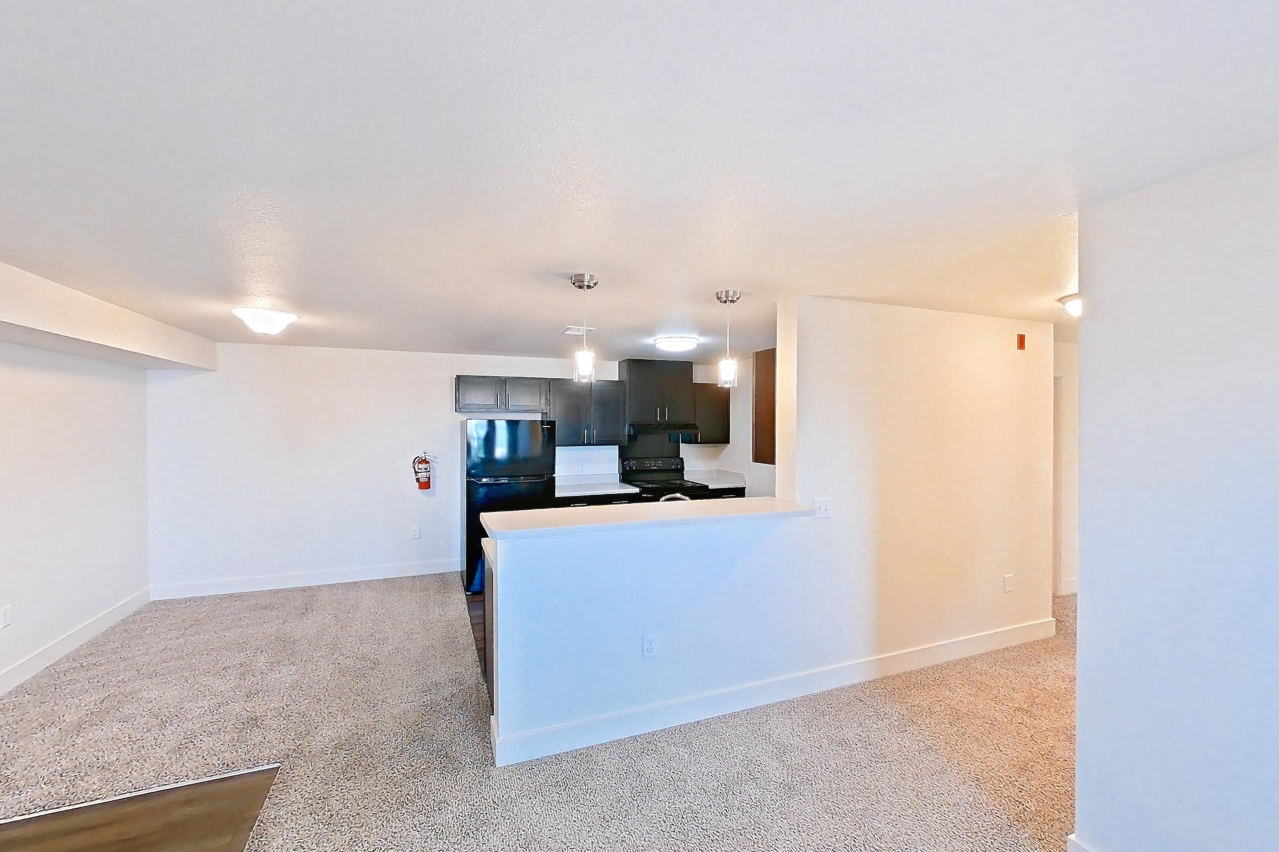Living space with black appliances, electric range, oven/range, and refrigerator, Apartment 4205 at Larkridge