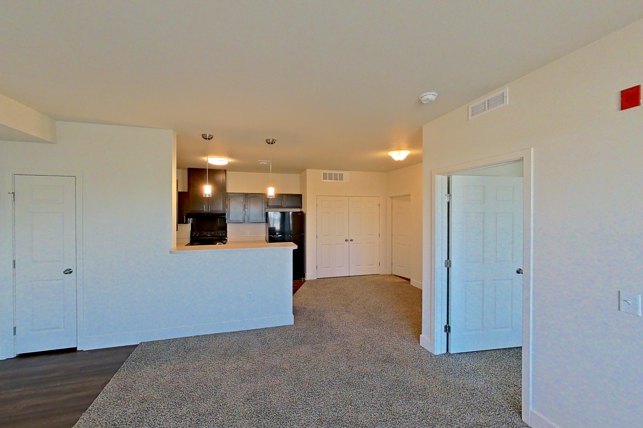 Living space with black appliances, oven/range, and refrigerator, Apartment 4307 at Larkridge