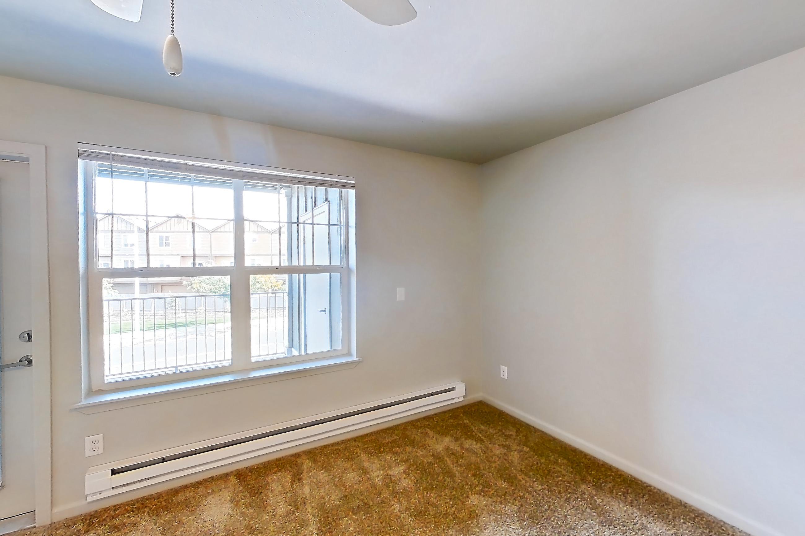Living room with baseboard heating, Apartment 714 at Sunset View