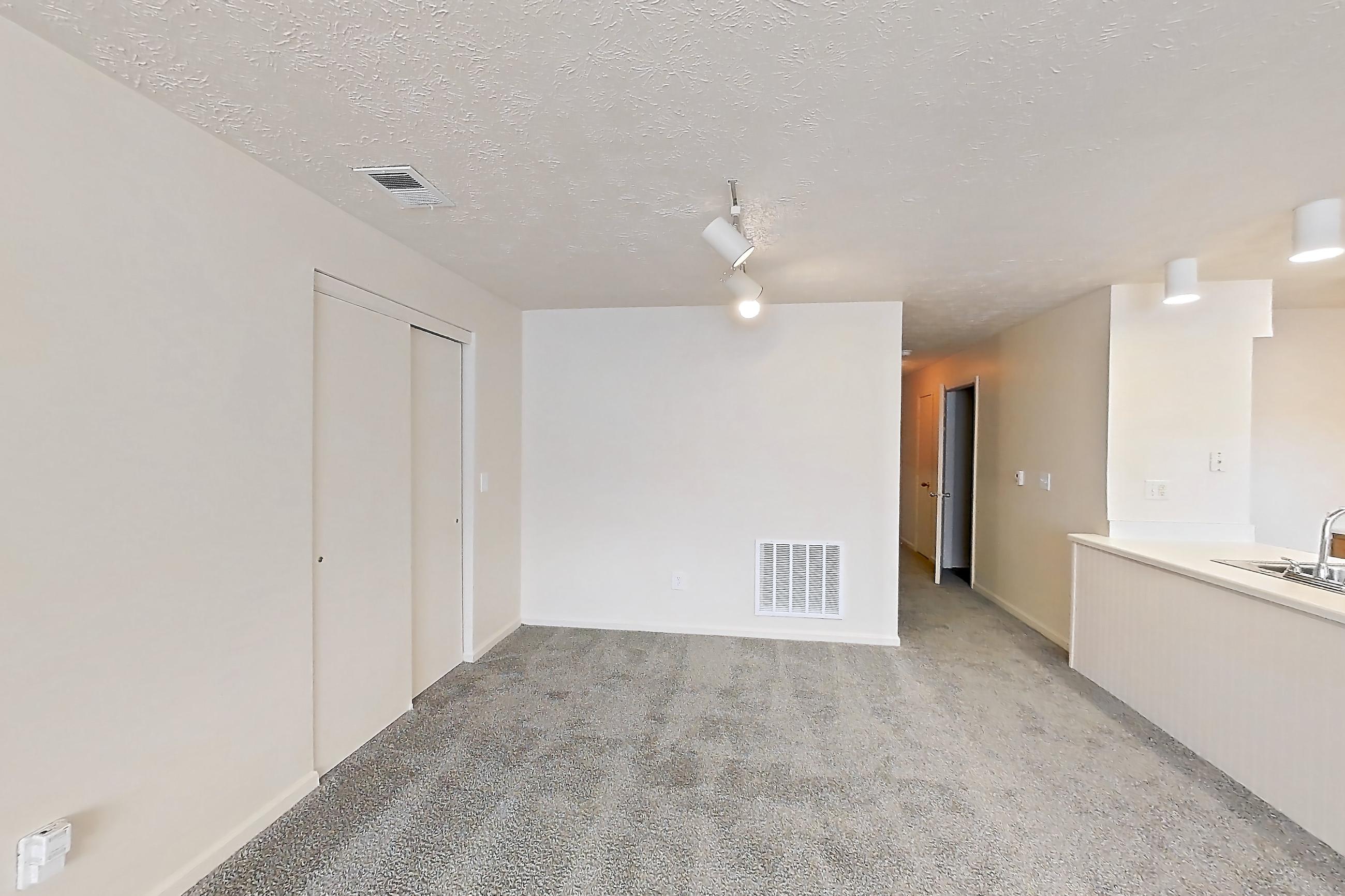 Living room with electric range, oven/range, refrigerator, and white appliances, Apartment 8142-H at Crooked Creek