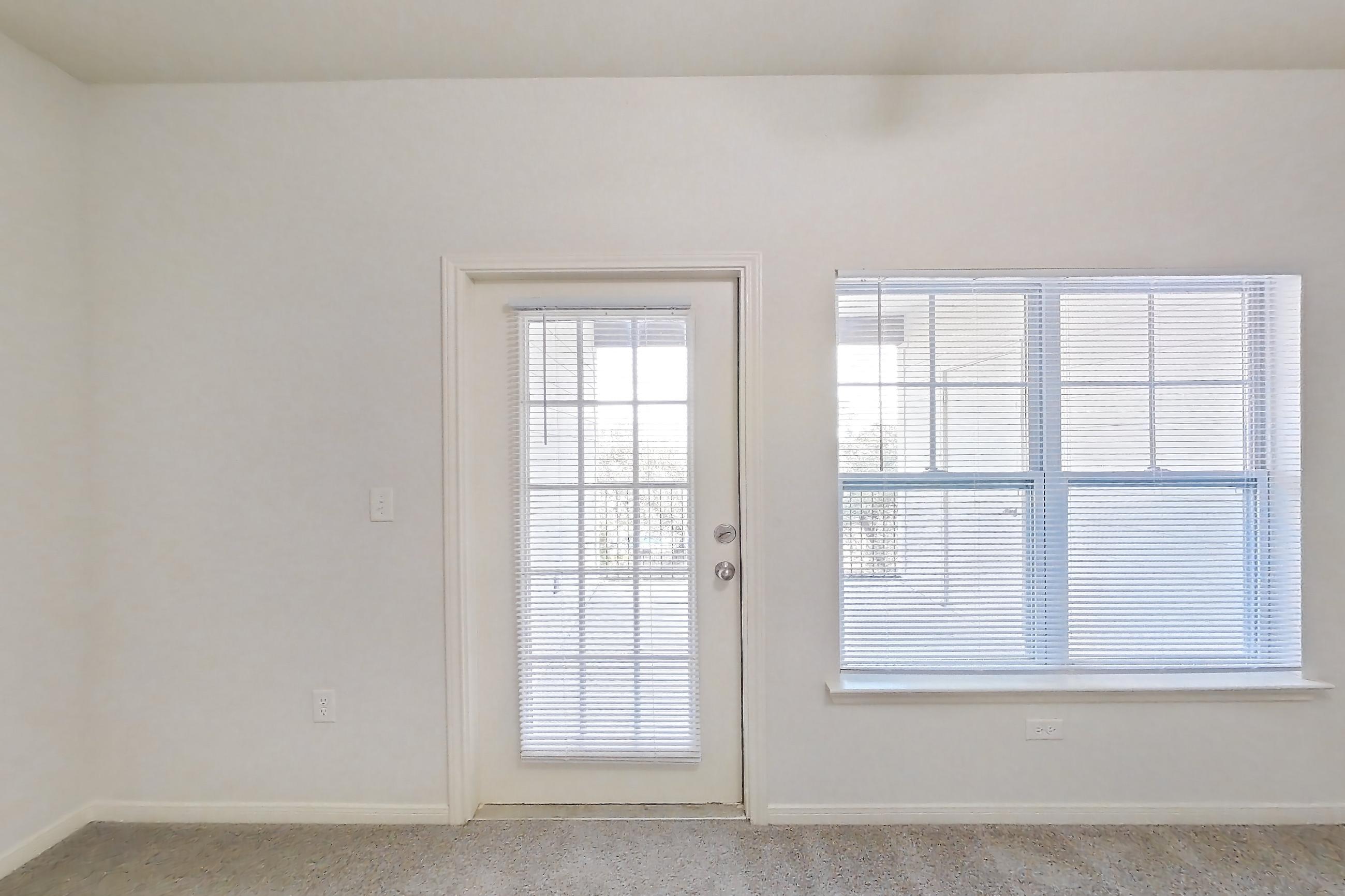 Living space with light carpet, Apartment 632 at Tuckaway