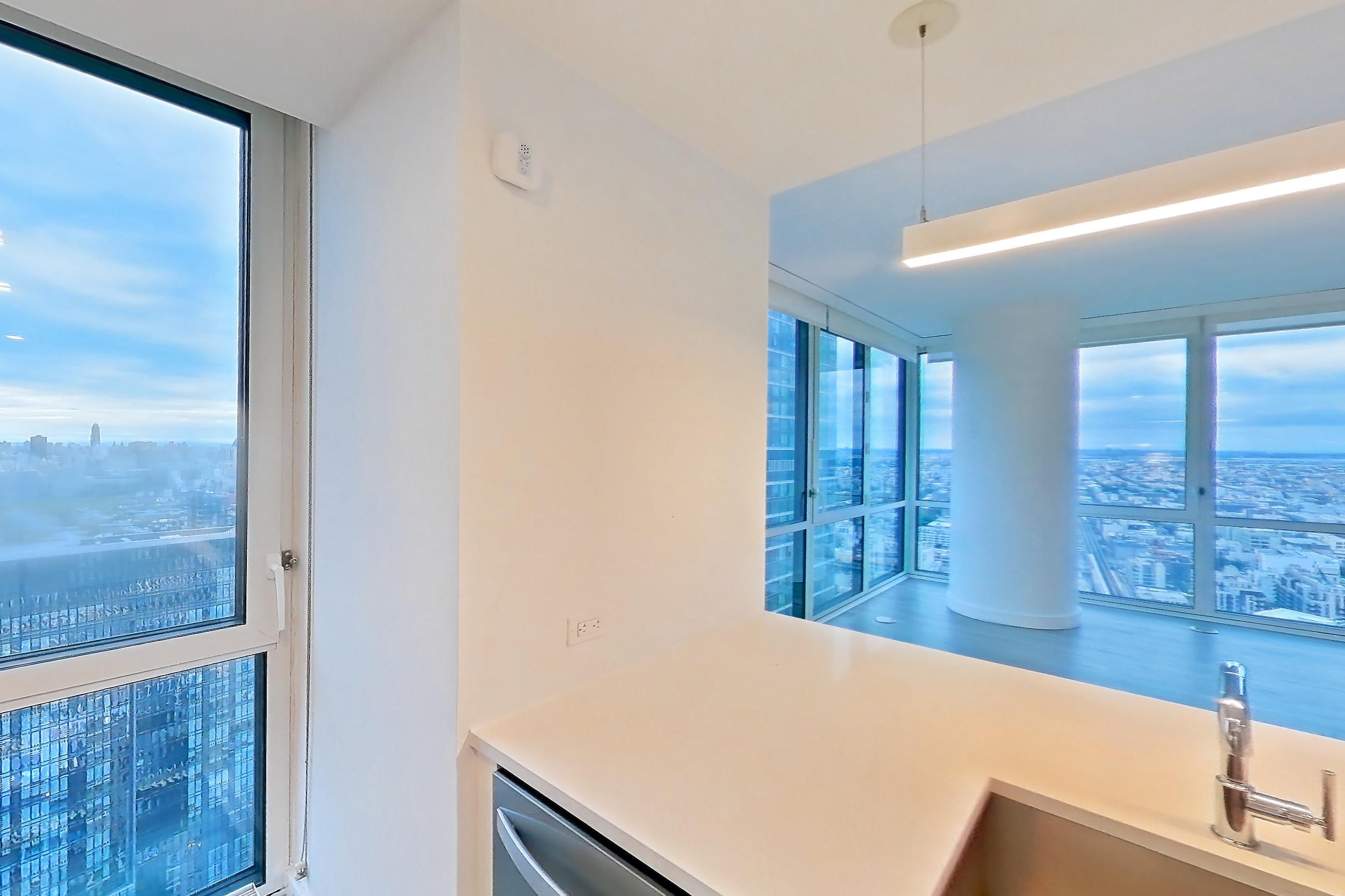 Kitchen with dishwasher, gas range, light countertops, light wood-finish flooring, oven/range, refrigerator, and stainless steel appliances, Apartment Ph2B at Alta+