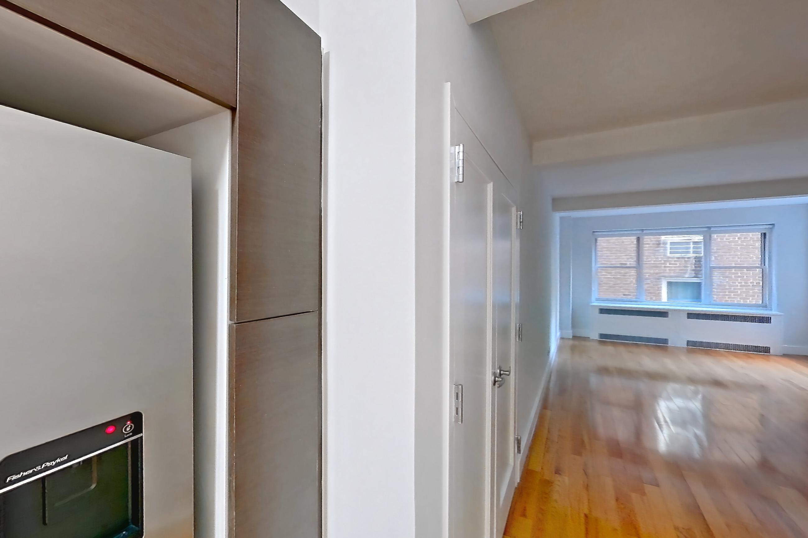 Dining room with baseboard heating, gas range, light stone countertops, light wood-finish flooring, oven/range, refrigerator, stainless steel appliances, water & ice dispenser, and wood-finish flooring, Apartment 6F at Stonehenge Leasing
