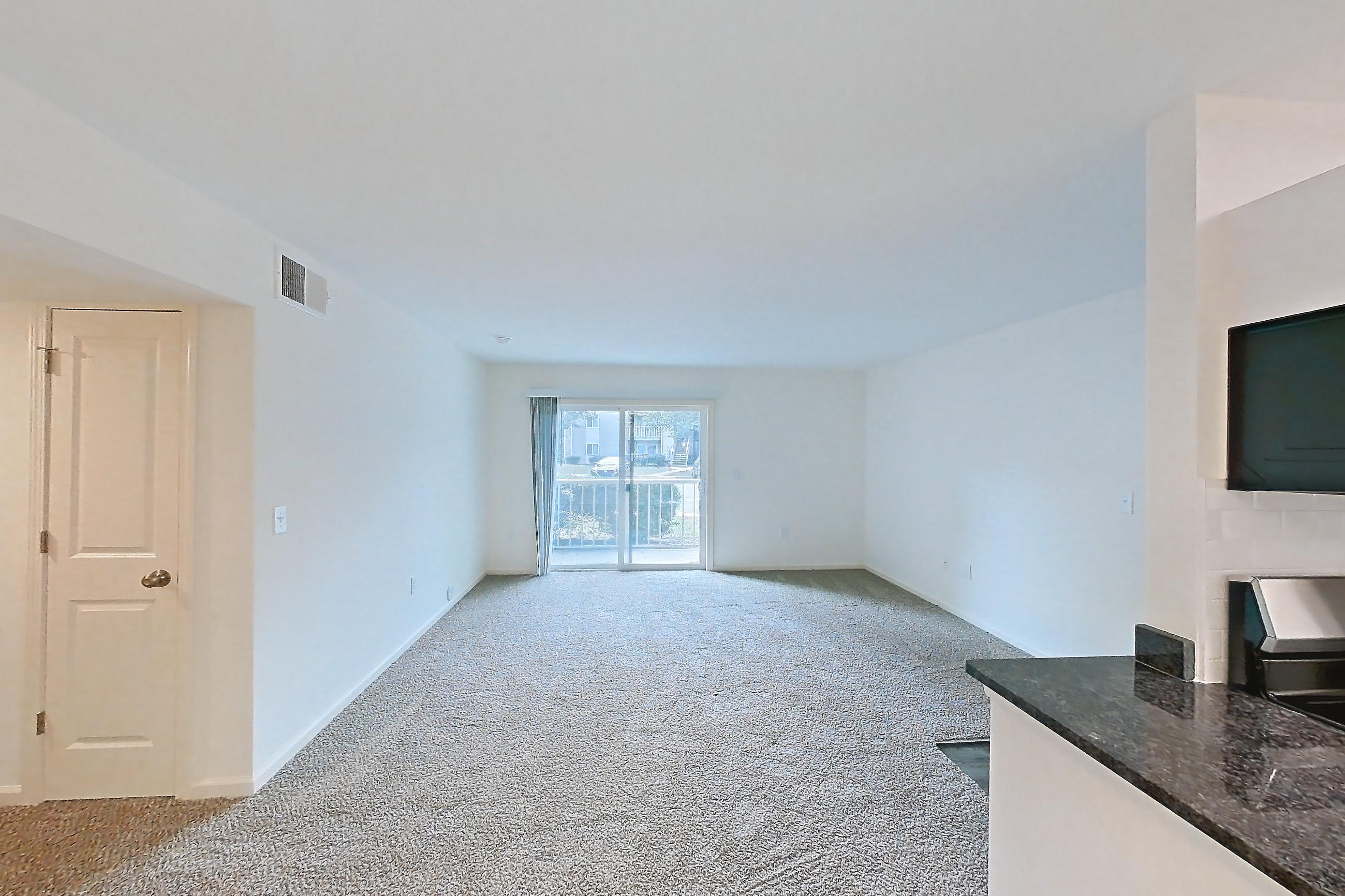 Dining room with dark carpet, dark stone countertops, dark wood-finish flooring, dishwasher, electric range, light countertops, oven/range, refrigerator, stainless steel appliances, and white appliances, Apartment 68108 at The Boulders