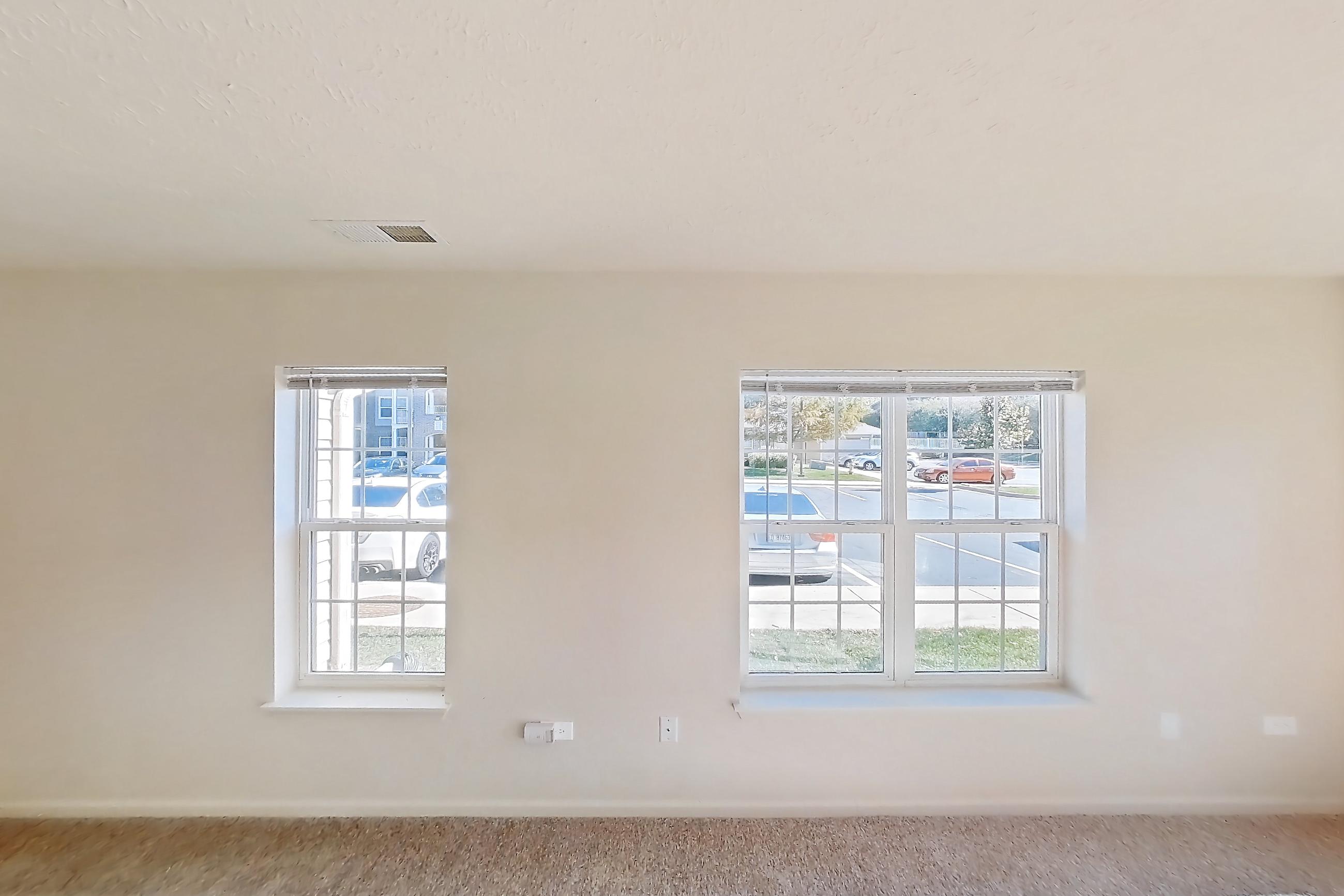 Living room with light carpet, oven/range, refrigerator, and white appliances, Apartment 418 at Village Park