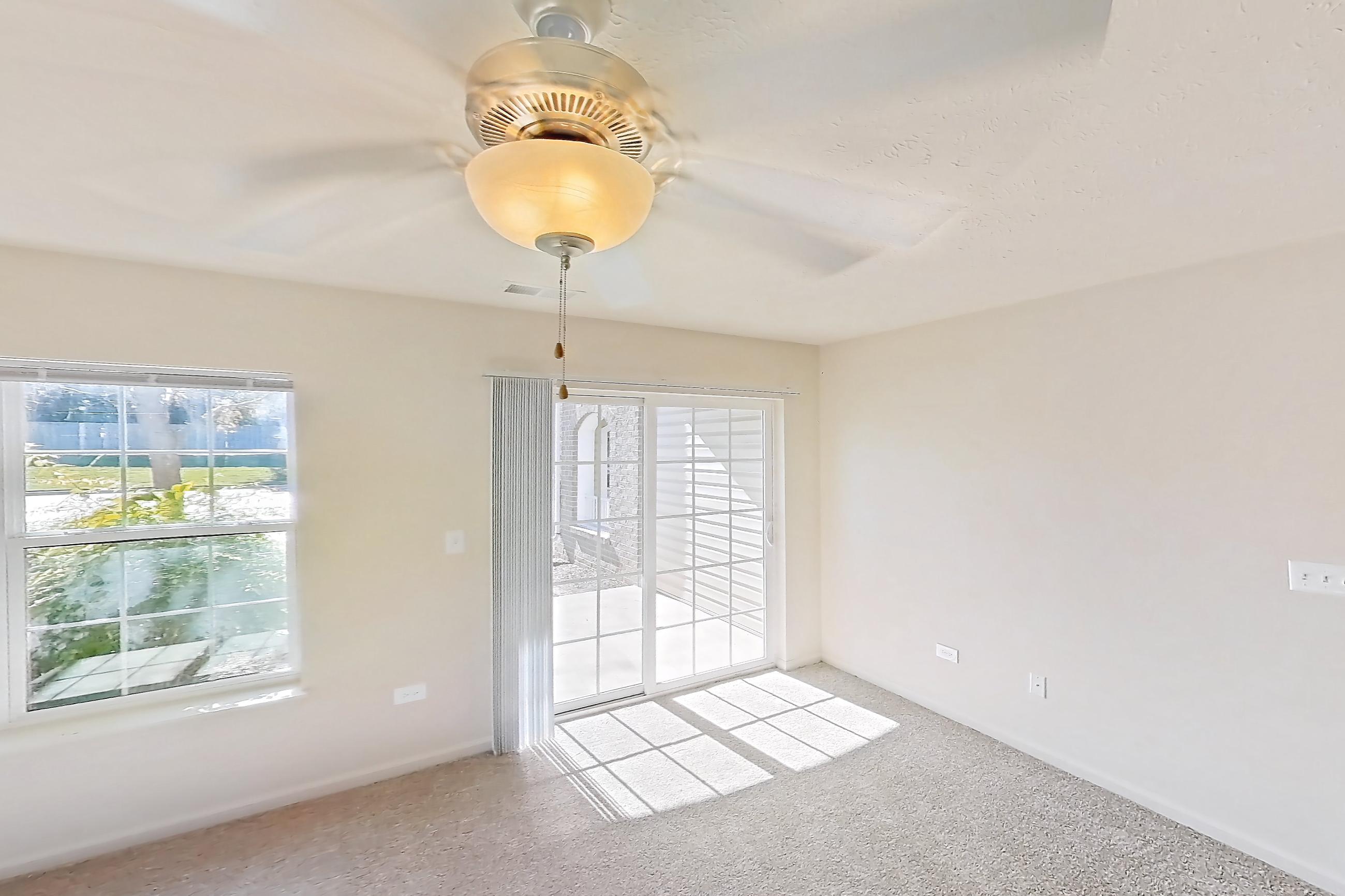 Living room with light carpet, oven/range, refrigerator, and white appliances, Apartment 418 at Village Park