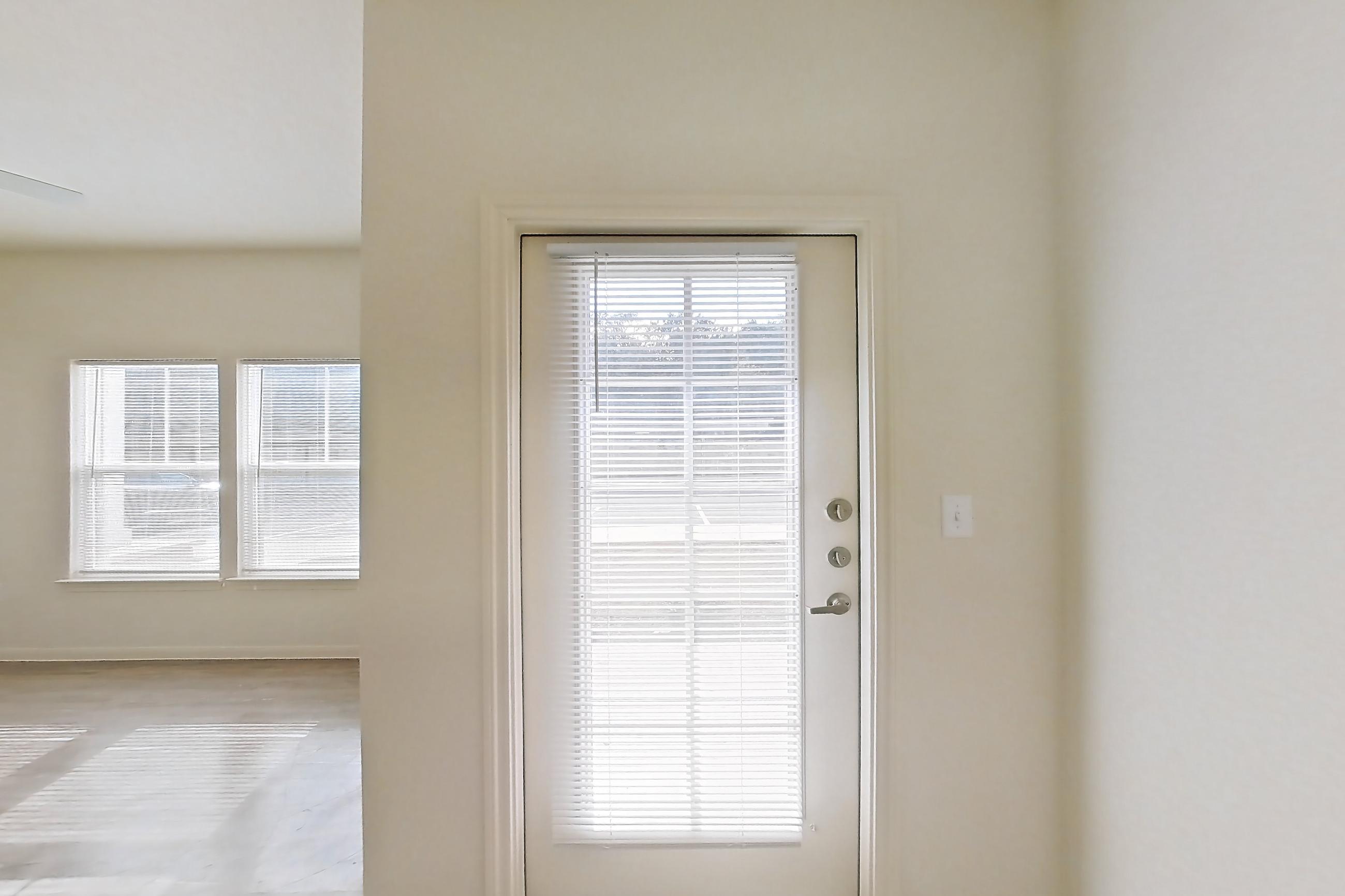 Dining room with light wood-finish flooring, Apartment 10101 at Crosswinds
