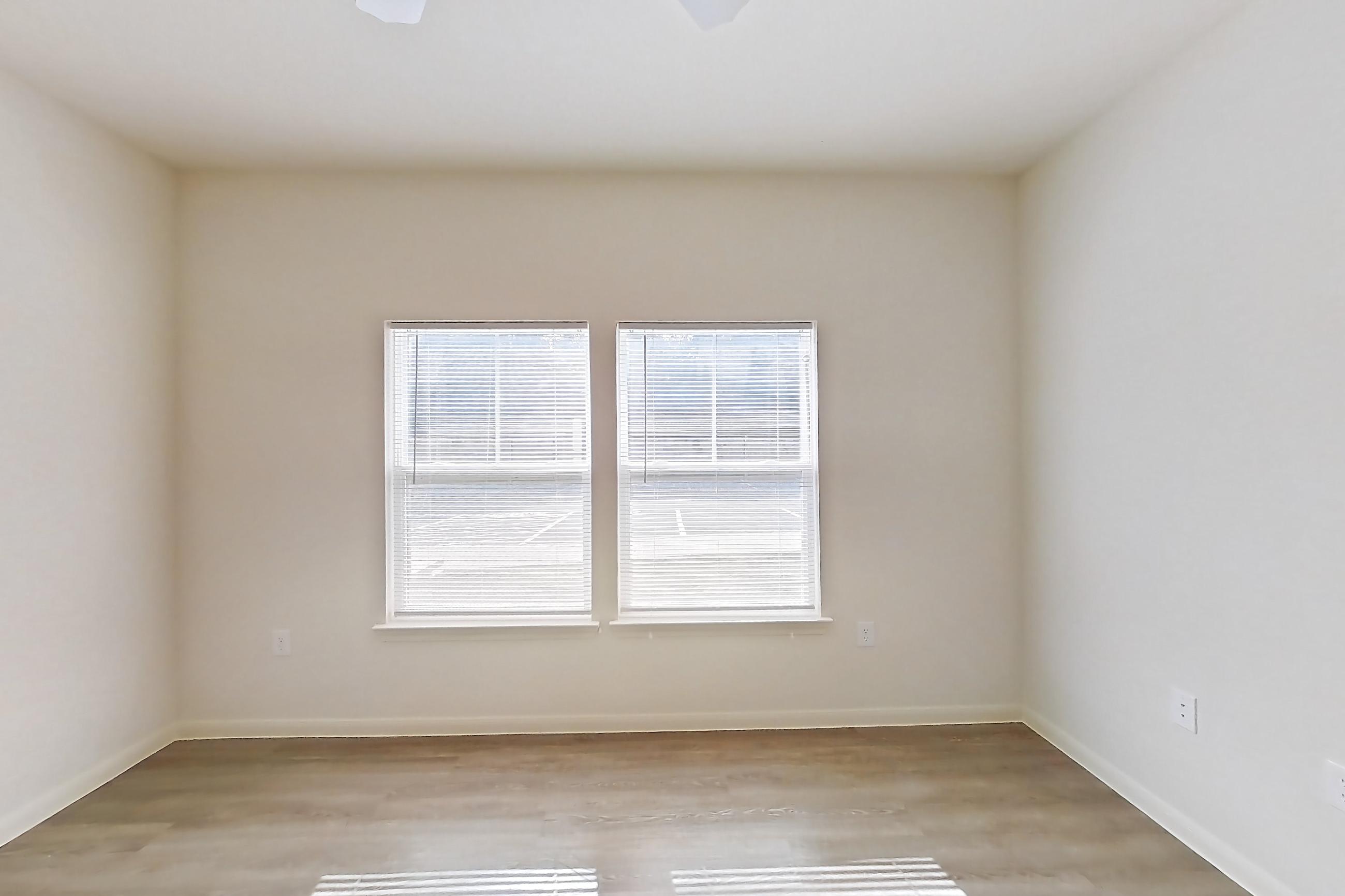 Living space with light wood-finish flooring, Apartment 10101 at Crosswinds