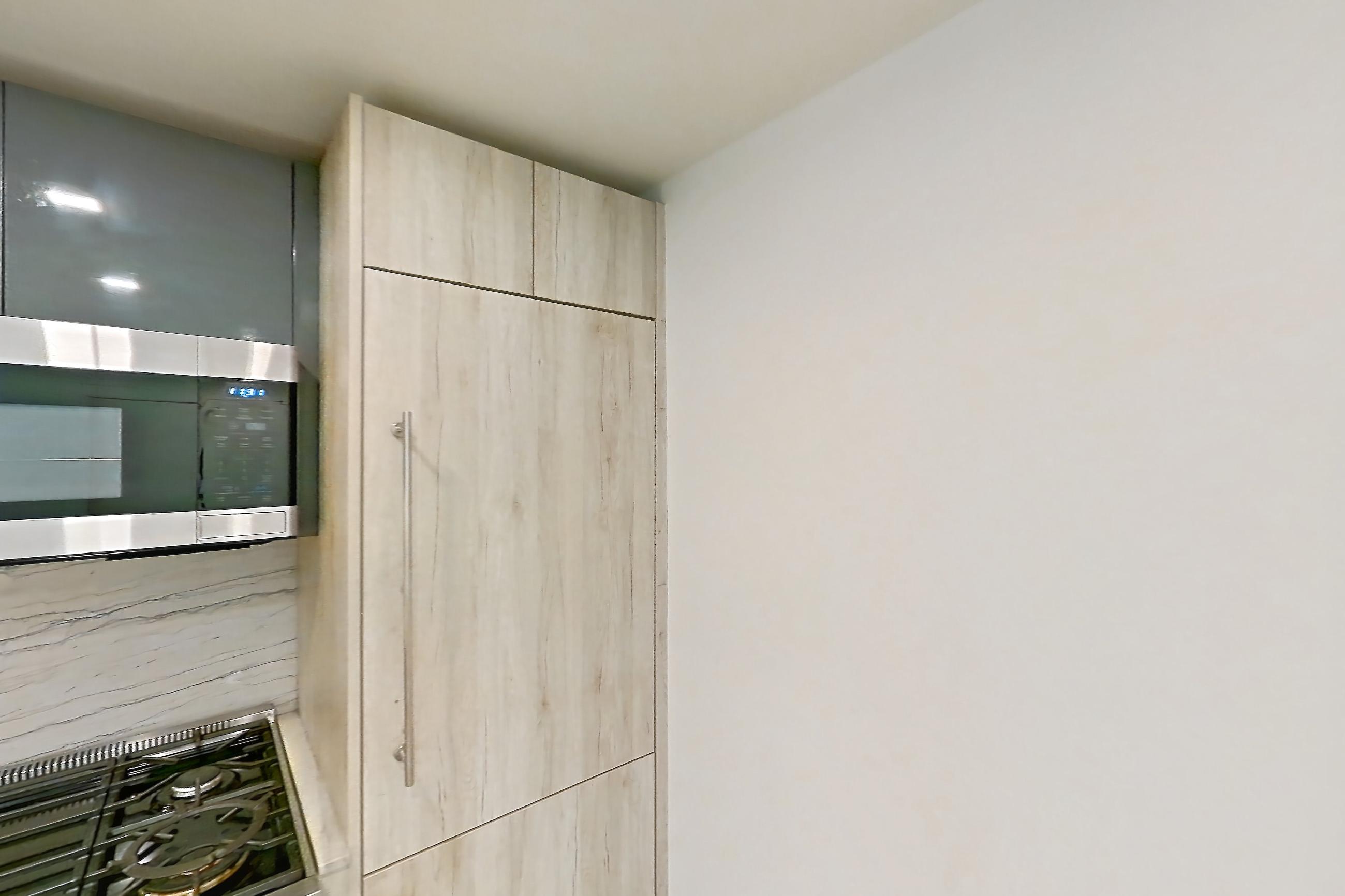 Kitchen with gas range, light countertops, light stone countertops, microwave, oven/range, and stainless steel appliances, Apartment 14D at Stonehenge Leasing