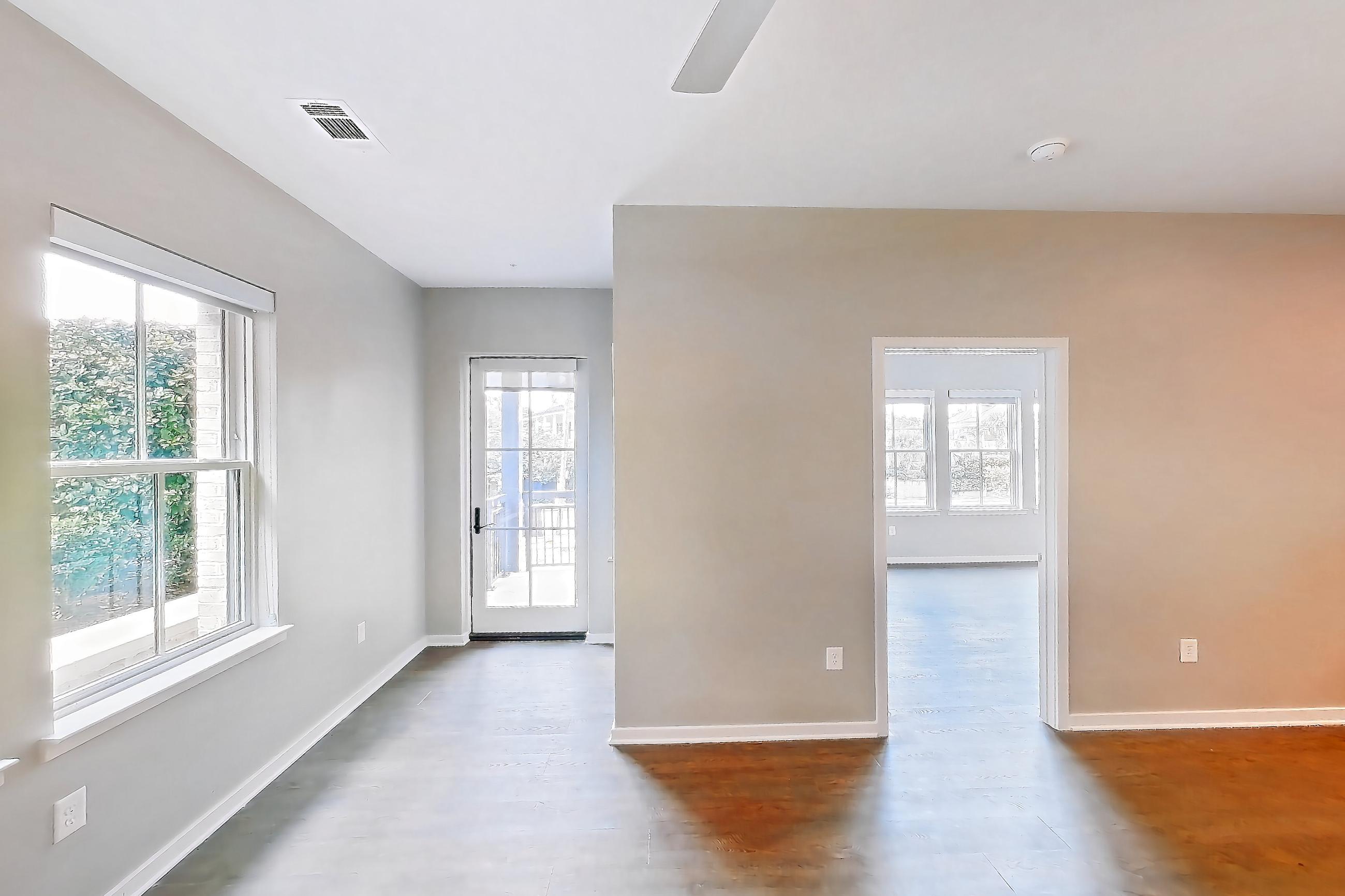 Living space with dark wood-finish flooring, gas range, kitchen island, light countertops, oven/range, refrigerator, stainless steel appliances, and water & ice dispenser, Apartment Test Unit at Peek Content Partner Demo