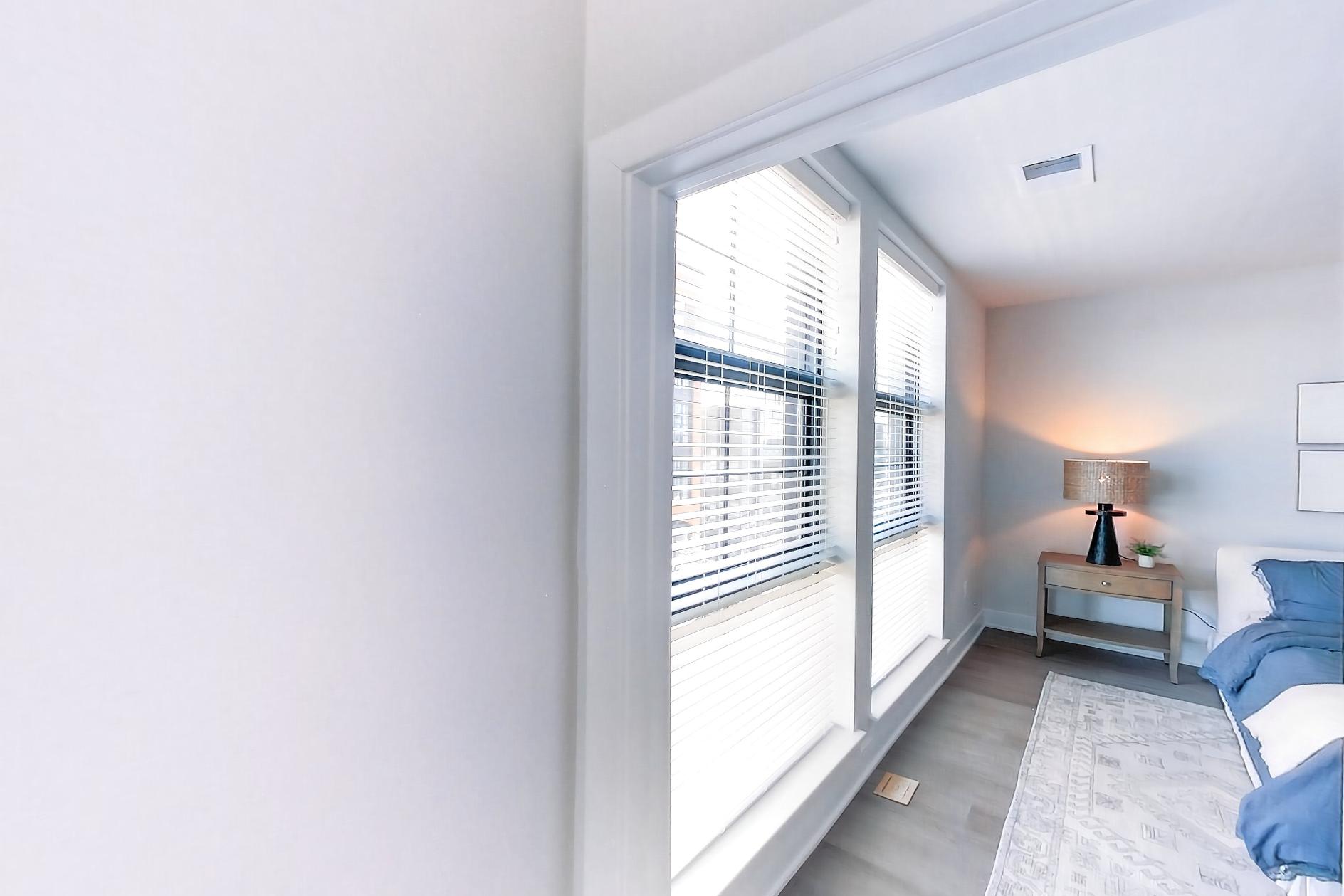 Living space side with light wood-finish flooring, Apartment L3 Model at Rye House