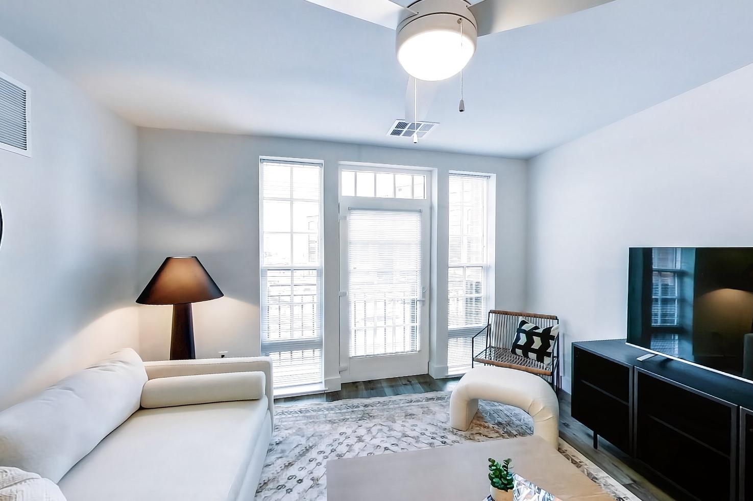 Living space side with dark wood-finish flooring and light wood-finish flooring, Apartment Model at 250 Mission